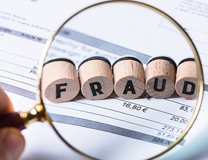 FRAUD in a magnifying glass